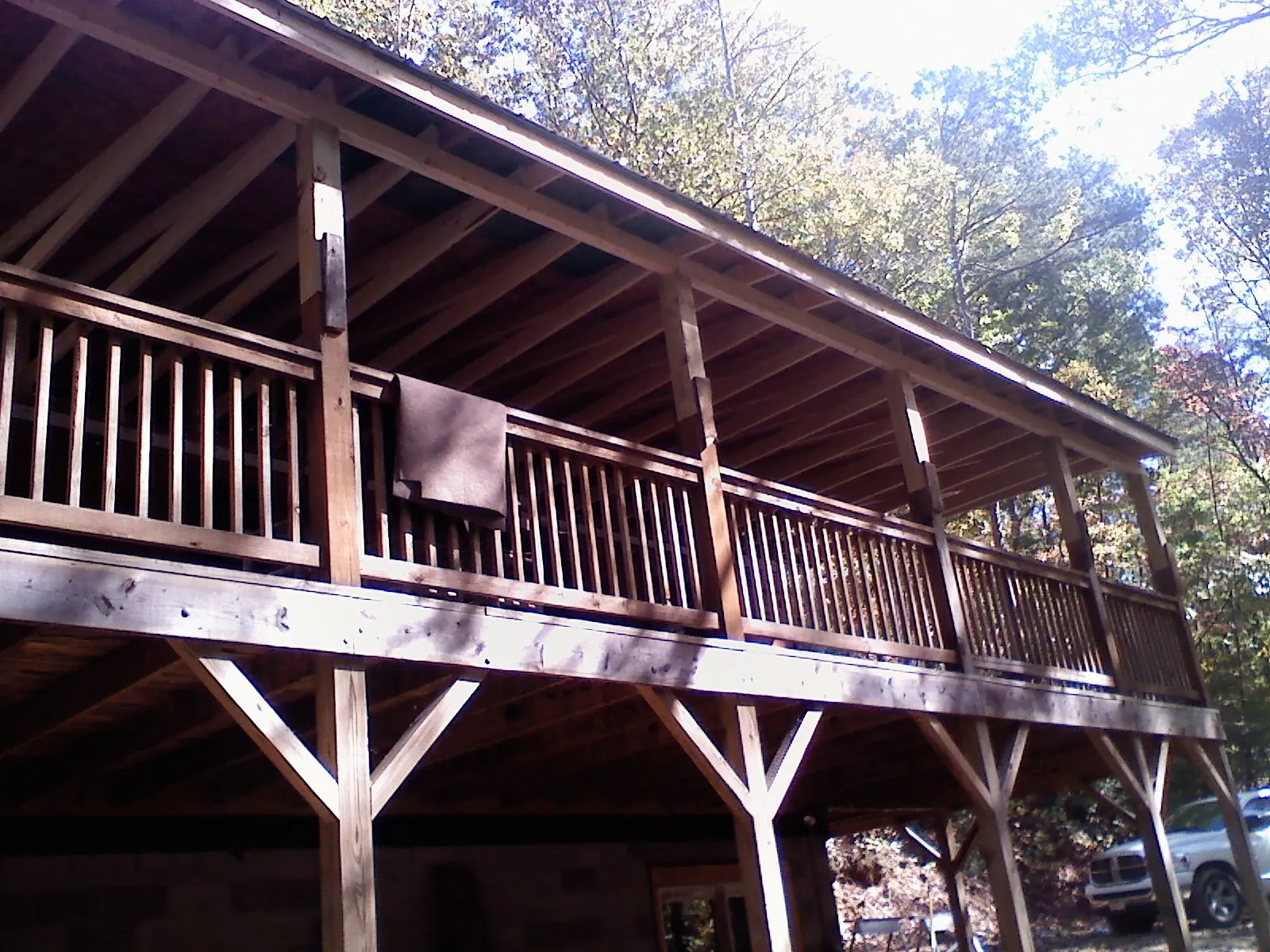 Timber framing under a new elevated porch and deck — Roof Leak Repair in Teton by Roofing Brothers